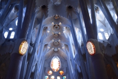 The columns are stronger than traditional Gothic arches, and have no need of a keystone at the top. Instead, to mimic sunlight filtering through the treetops, Gaudi put windows there.