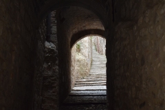 A really long stair that we had just come down before visiting a vermouth and olive bar.