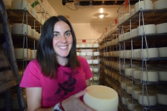 Laura, displaying one of the 22,000 cheeses she will make this year.