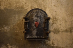 A tank, still in use, with the access door still showing the old owners' design.