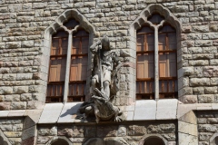 Most of Gaudi's buildings had a St. George theme, whether with a statue like this or because the tiles on the surfaces and the roof angles were like scales.