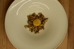 Sauteed chantarelles with a charred egg yolk.