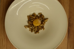 Sauteed chantarelles with a charred egg yolk.