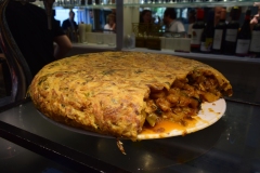 Once we met our instructor, Patricio, he took us to a tiny little ten-seat bar-style tapas joint where they made this incredible Spanish omelet, which they all called a tortilla. We had not ordered Spanish omelets prior to this, thinking they were plain old omelets. And apparently many are, but not this one. It was mouthwateringly delicious.