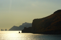 Baia di Ieranto, where Odysseus encountered the Sirens. In the distance on the left are the petrified bodies of the three sisters.